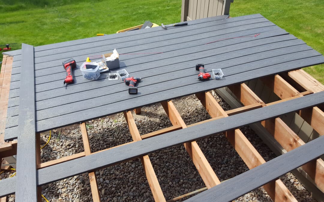 A gray PVC deck mid installation