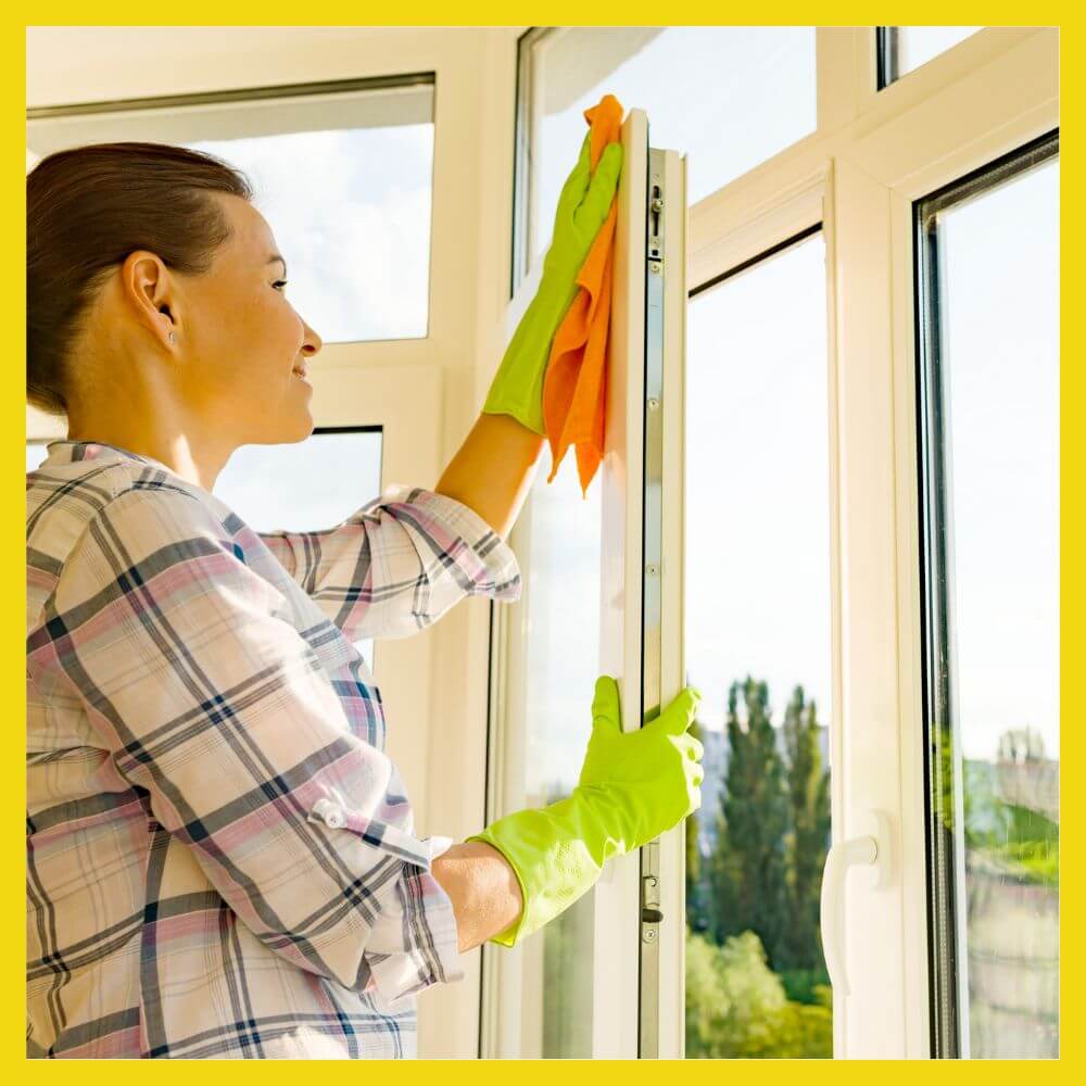a-woman-cleaning-the-window